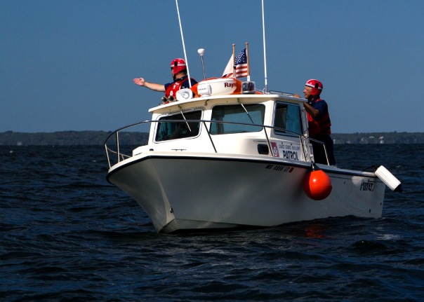 Boat Crew finds the position of rescue equipment dropped from an Air Station Cape Cod HC-144 during a traiing mission.